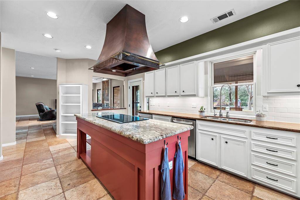 Boasting impressive storage, the center island also features an outlet for easy mixing and prepping with small kitchen appliances. Store cookie cutters and cupcake supplies beneath for impromptu baked goodies, which of course always require an urgent need!
