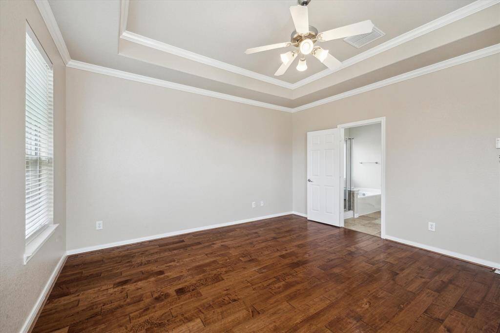 Primary Bedroom with wood flooring!!!