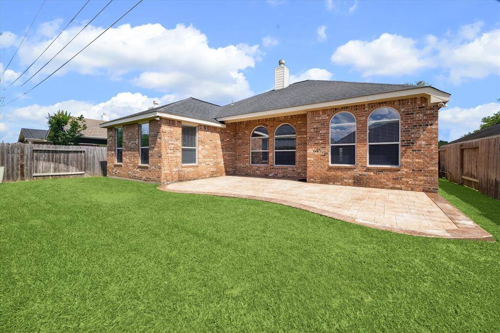 Stamped concrete on back patio and a gorgeous backyard!!
