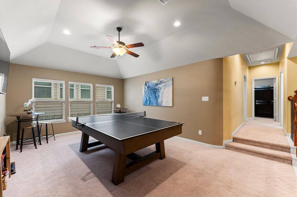 Tucked just off the game room, a hallway invites you toward a generously sized full bathroom and three well-appointed bedrooms—perfect for family, guests, or flexible living options.