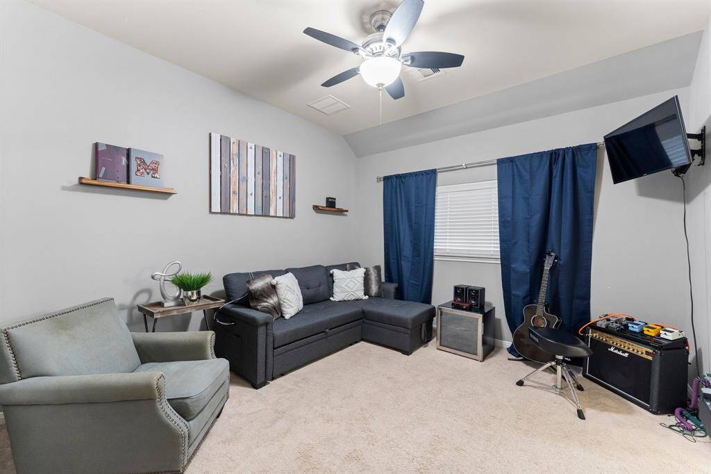 Directly across from the bathroom, a secondary bedroom features a large window, a spacious walk-in closet, and convenient access to a Jack and Jill bathroom perfect for shared living or guests.