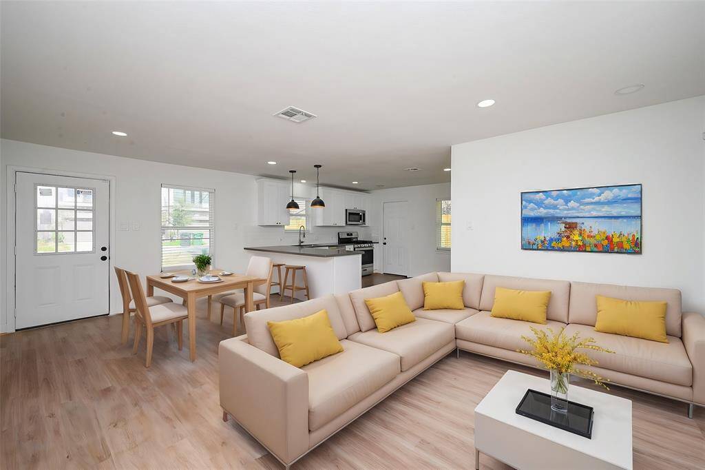 Virtually Staged: Fantastic open layout between the living, dining, and kitchen areas.