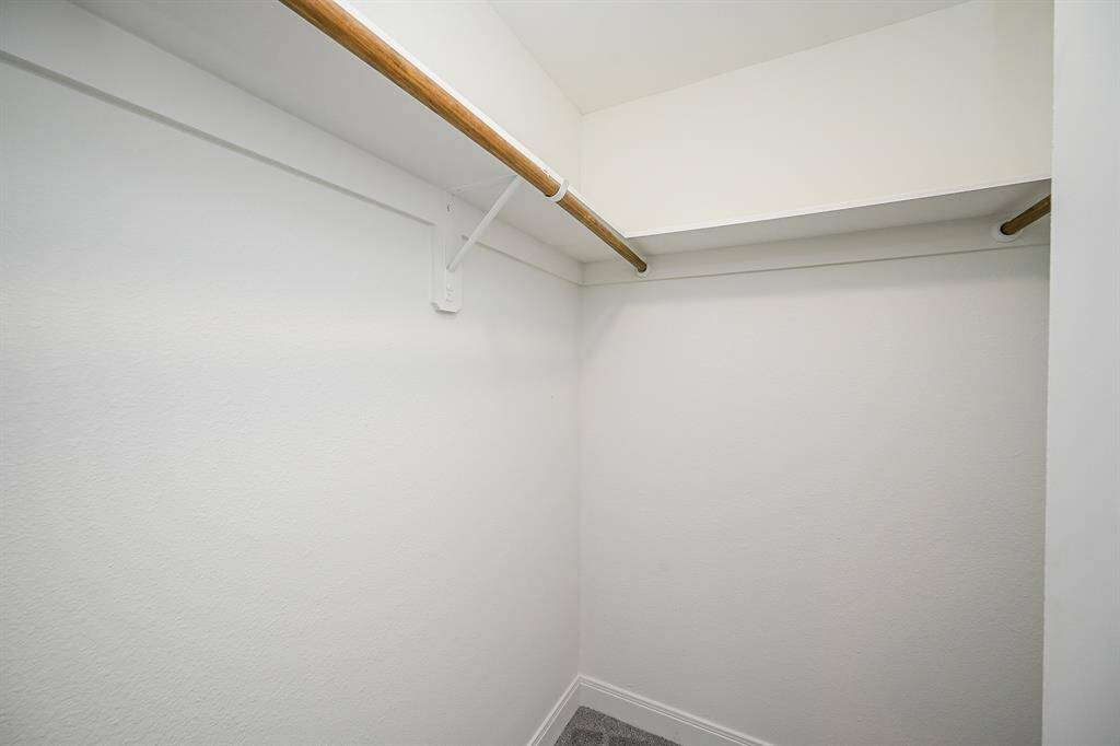 Spacious walk-in closet in the primary bedroom.