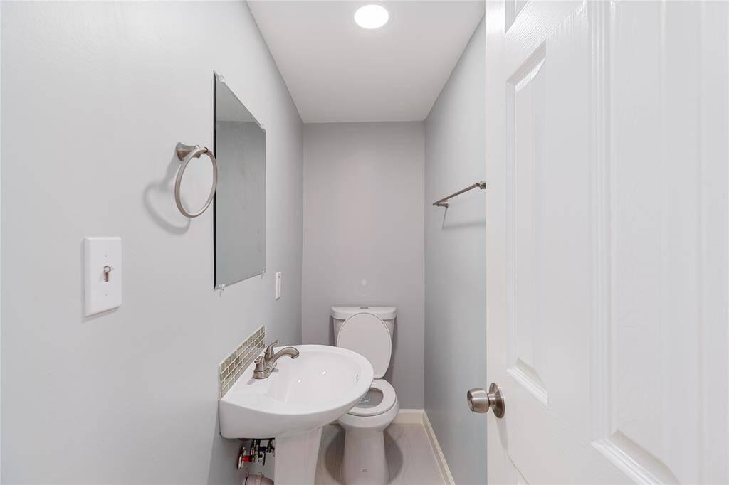 Bathroom 2 has a stand-up shower, toilet and sink
