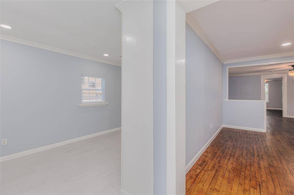 Entry hallway leads to the living room or the bedrooms
