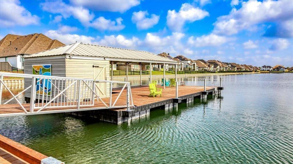 Charming lakeside community with a spacious dock and covered seating area, offering serene water views and a lovely community feel. Perfect for relaxation and outdoor enjoyment.