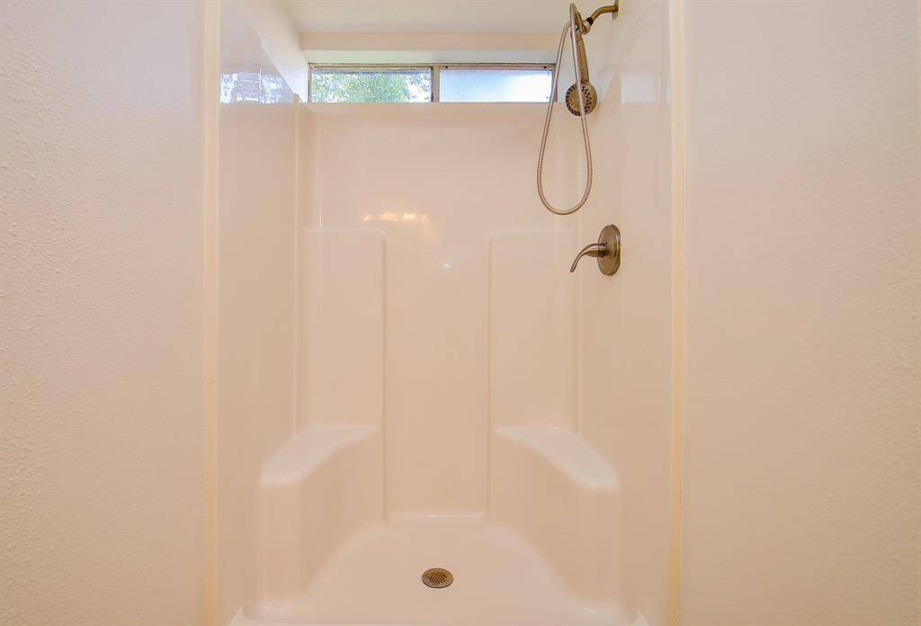 Walk-in shower in primary bathroom.