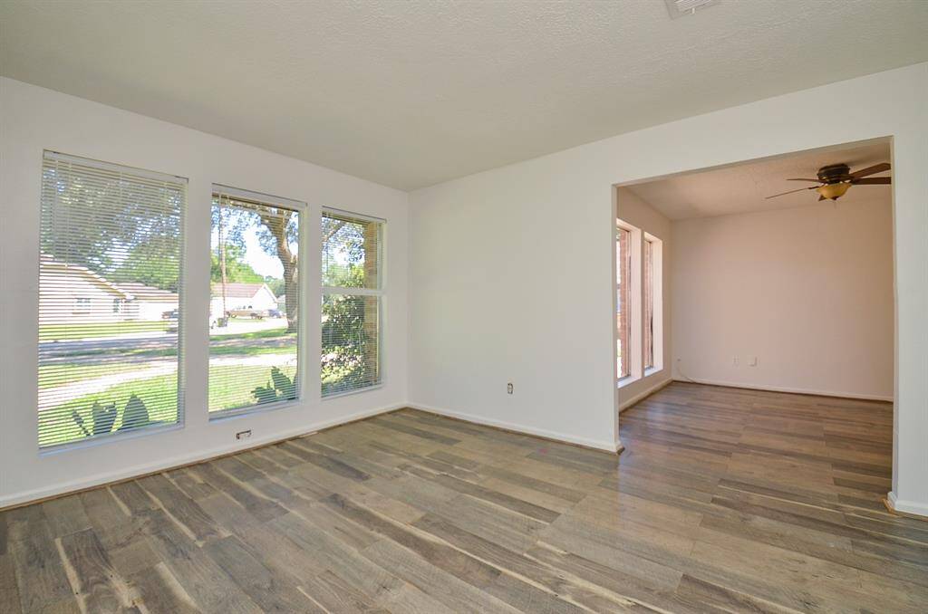 This formal living area could be a great office space or place room.