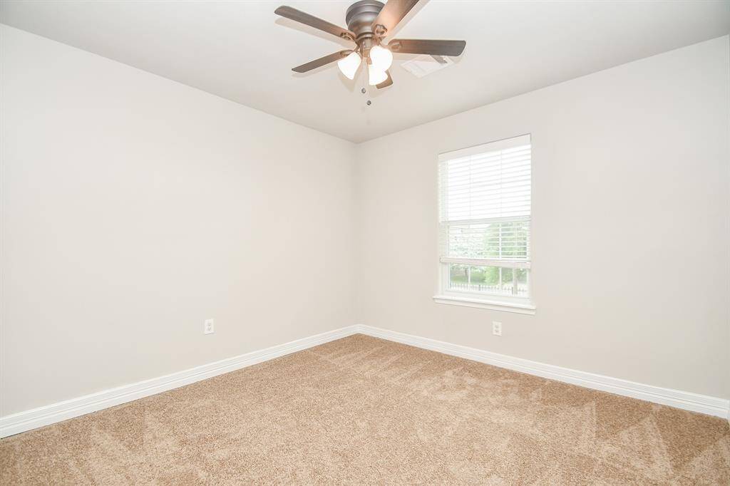 The primary bathroom offers a spacious retreat with double sinks, a large walk-in closet, and a built-in ceiling speaker — perfect for enjoying your favorite music while you get ready or wind down