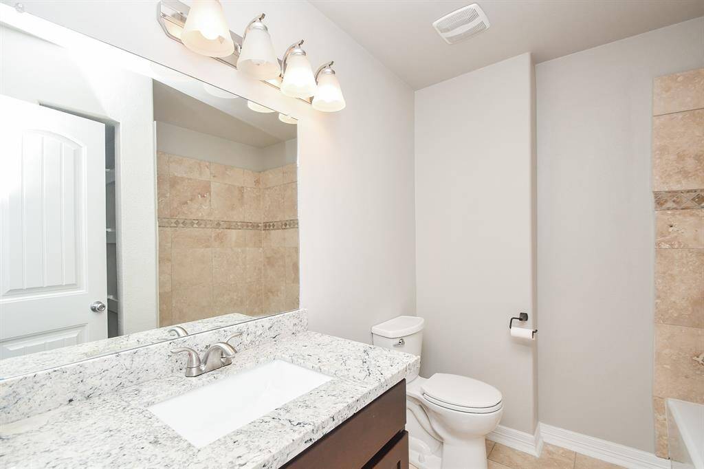 The primary bathroom offers a spacious retreat with double sinks, a large walk-in closet, and a built-in ceiling speaker — perfect for enjoying your favorite music while you get ready or wind down