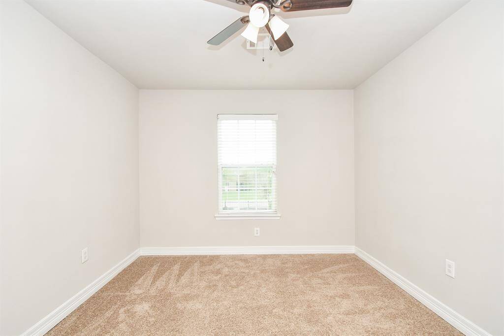 Both secondary bedrooms are generously sized and face the front yard, offering a bright and balanced layout perfect for children, guests, or a home office setup. Each room includes a roomy closet and neutral finishes, making them easy to style to your needs.