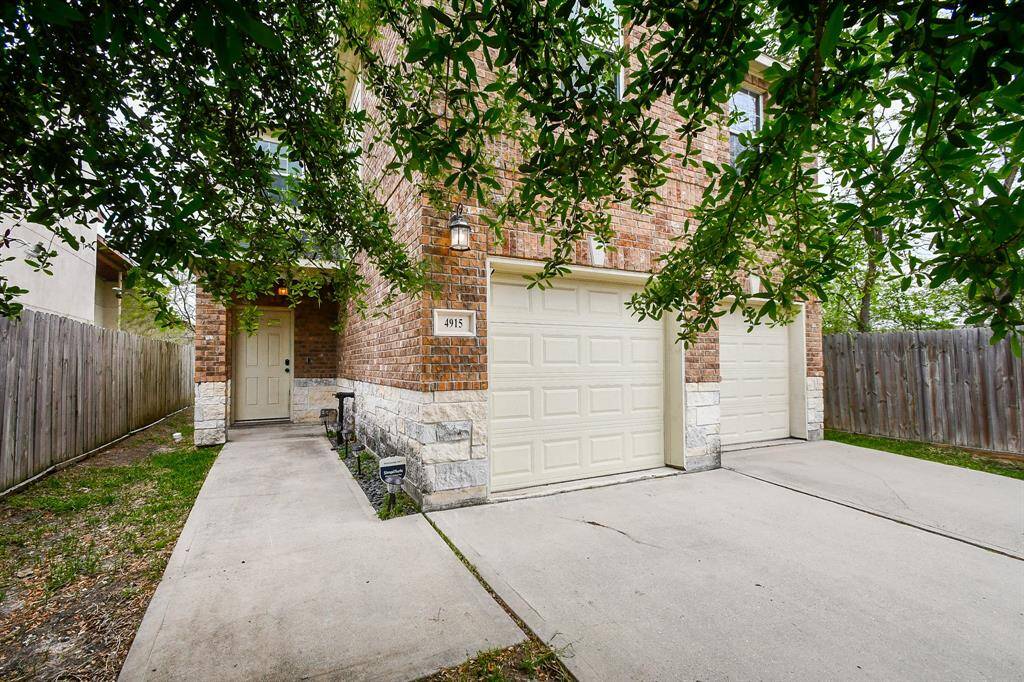 Step through the front door into a welcoming entryway featuring soaring ceilings and a stunning hanging chandelier that adds elegance and charm from the moment you walk in