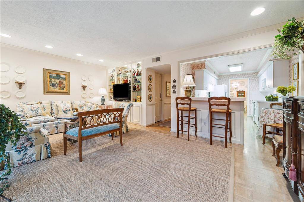 The den is large enough for two sitting areas or a second dining area.