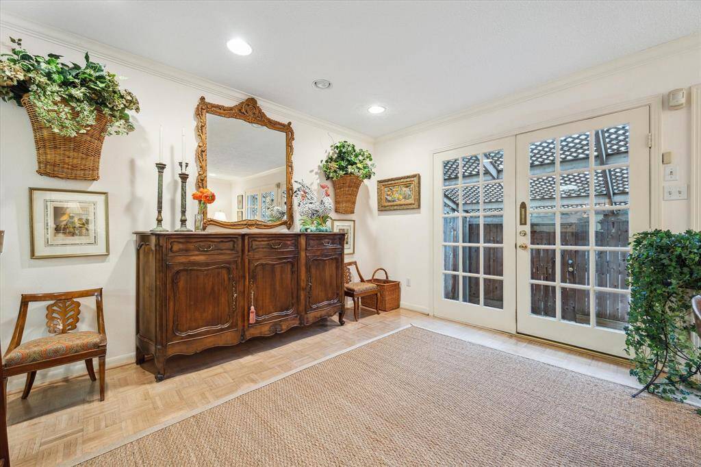 French doors from den open to patio.