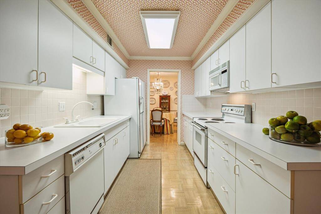 Another view of the kitchen looking into the dining room. Great counterspace and storage.