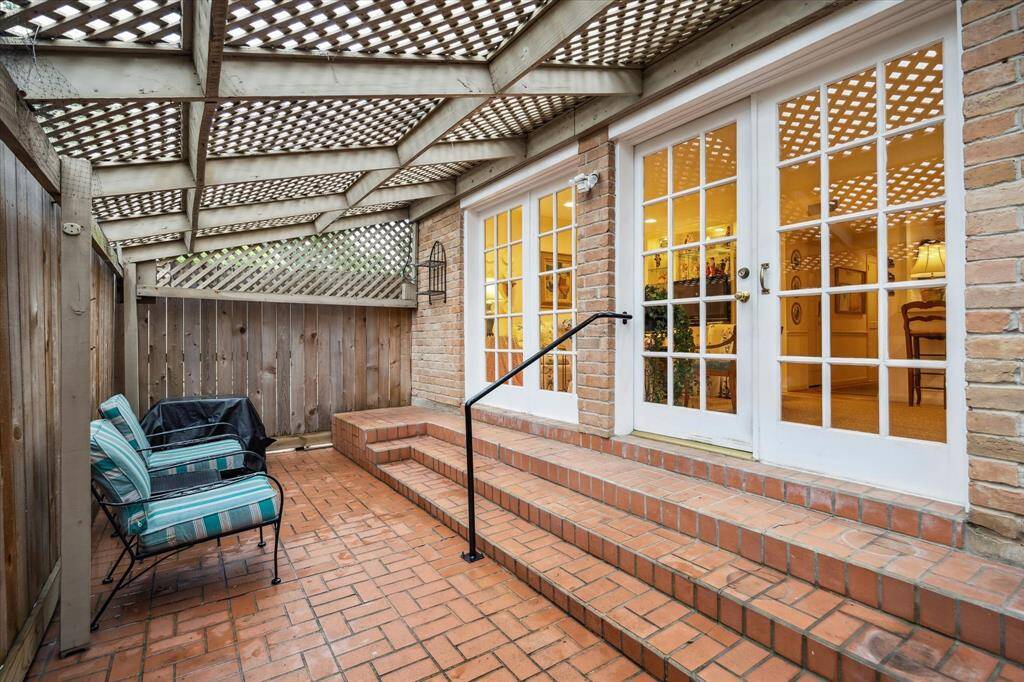 The large den overlooks the brick patio.