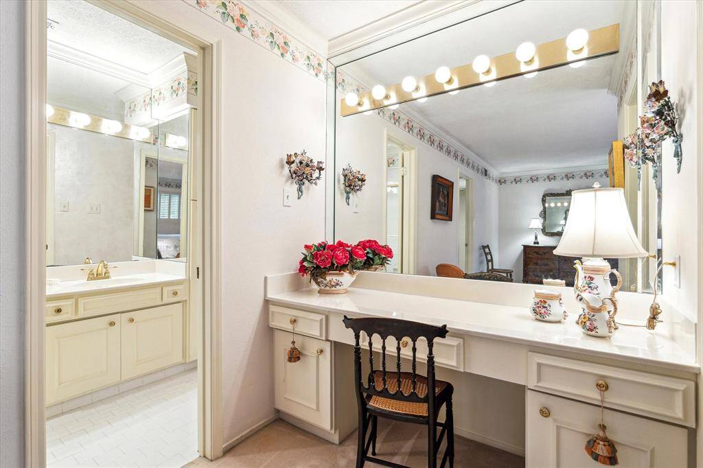 Primary vanity area and bath.