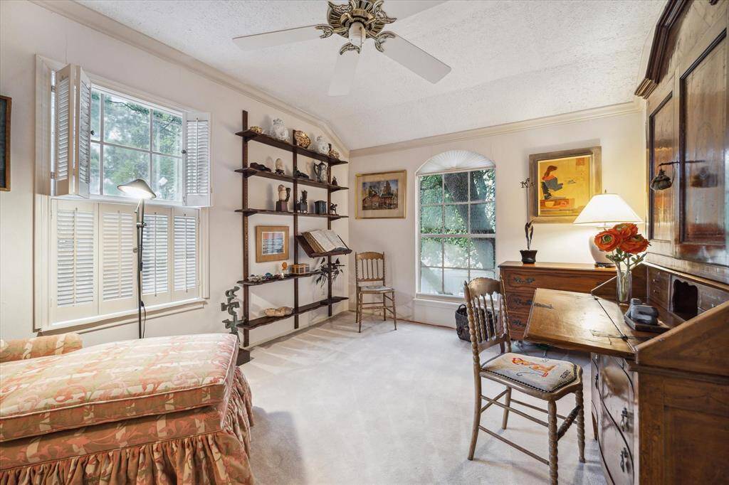 Upstairs second bedroom currently used as a study and home office. Being an end unit you get windows on two sides of the room.