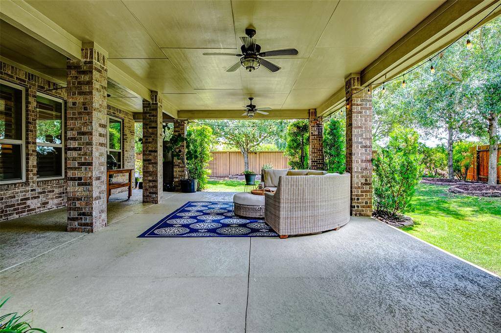 Three ceiling fans provide year-round comfort, keeping the space cool in the summer and circulating air during cooler months.