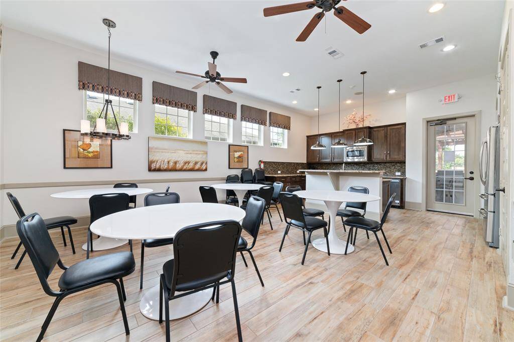 This dining area of the clubhouse offers several round tables and chairs for use with your event reservation.