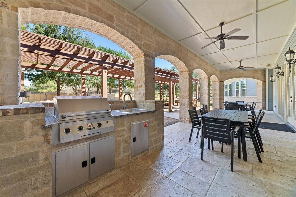 The best part is that you have access to the spacious outdoor patio with a built-in grill, sink, a large dining table, and a pergola-all available when you reserve the clubhouse.