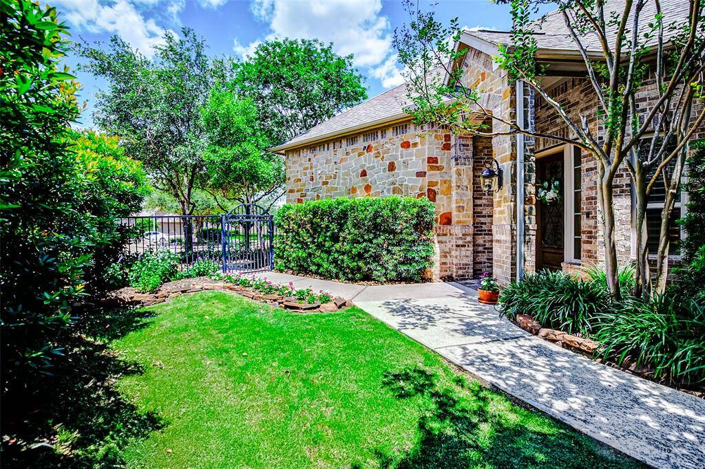 The secure iron fencing adds both safety and style, enclosing the front and backyard to create a protected space giving you peace of mind while enjoying outdoor living.