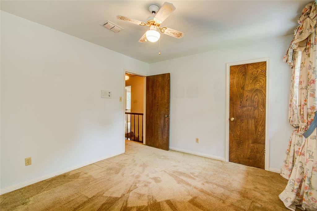 First of 3 upstairs secondary bedrooms overlooks the front of the home.