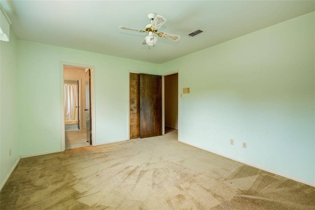 The second bedroom has direct access to the bathroom and overlooks the pool.
