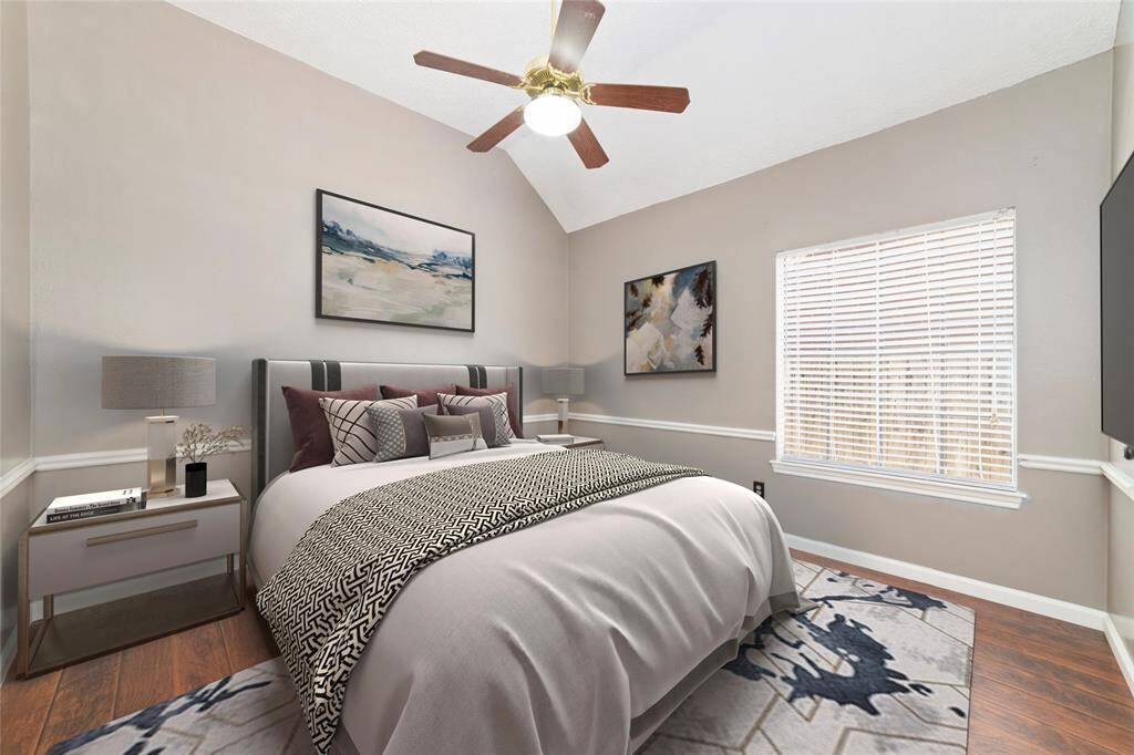 Secondary bedroom with wood floor, virtual staging