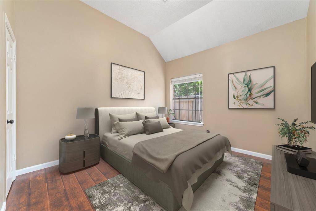 Secondary bedroom with wood floor, virtual staging