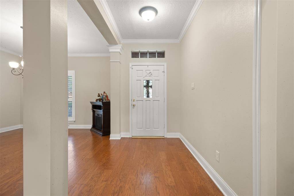 The formal dining is just off front entry door. Would make a great in-home office/study.