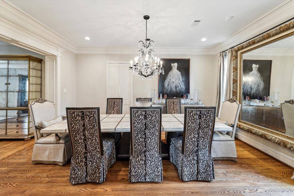 The thoughtful combination of classic design elements and modern touches makes this formal dining room a perfect blend of style and comfort, ideal for both intimate gatherings and elegant entertaining.