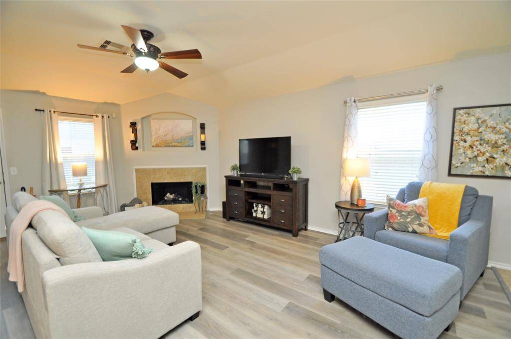 The family room is cozy and bright.  The laminate flooring is in all the rooms where there is not tile.