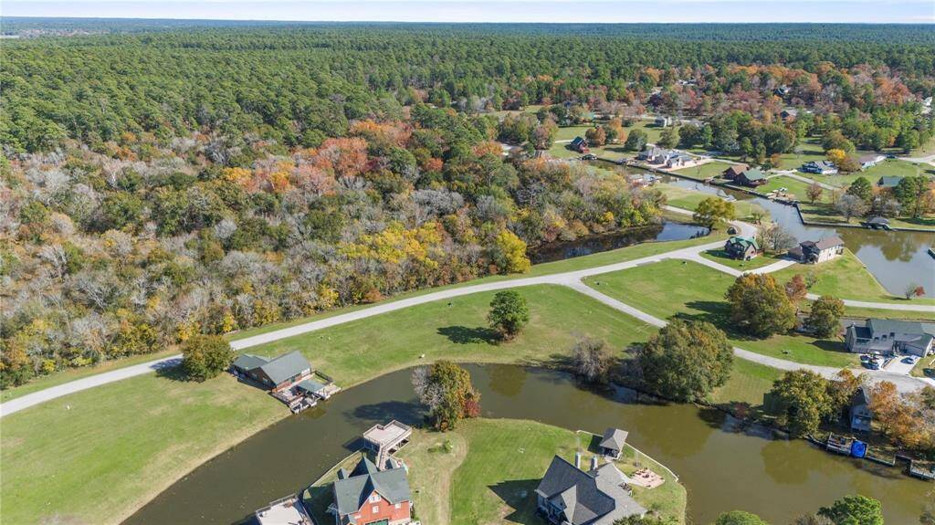 Oversized corner lot with canal frontage