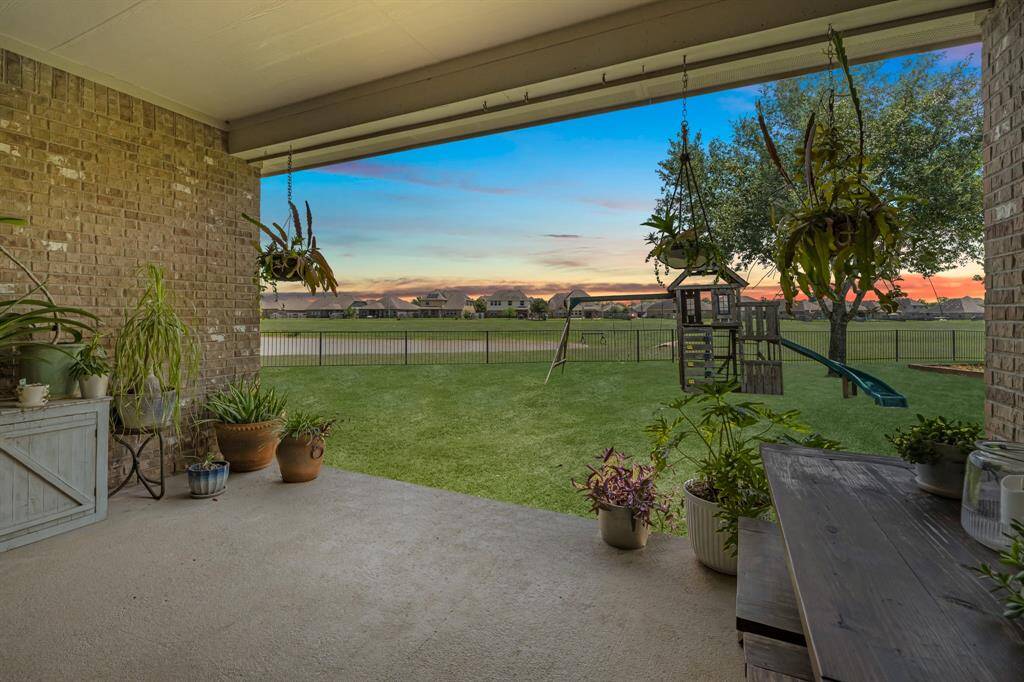 Splendid covered back patio overlooking to water.