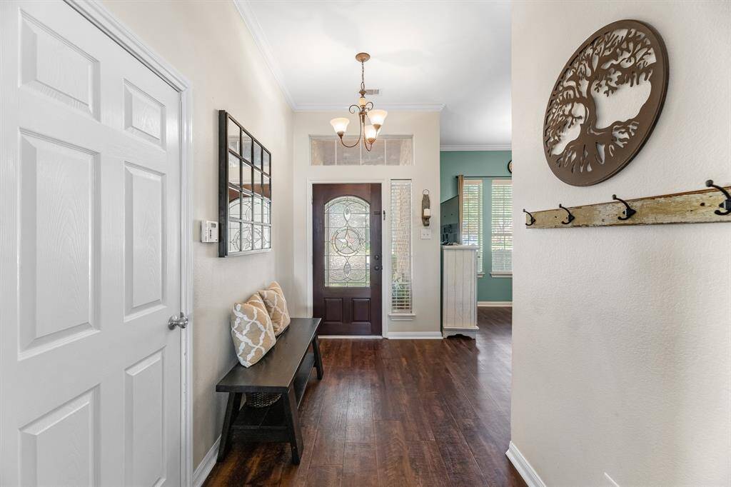 Front entry foyer with vinyl flooring.
