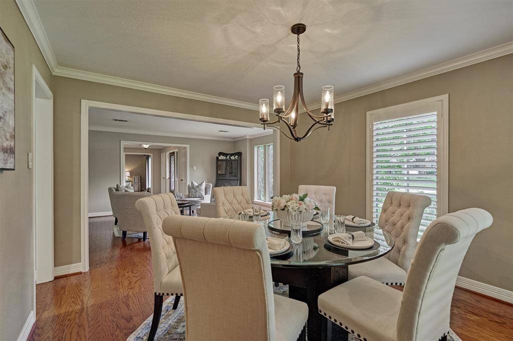 The adjoining formal living area is visible, showcasing the open-flow for enjoyable get-togethers.