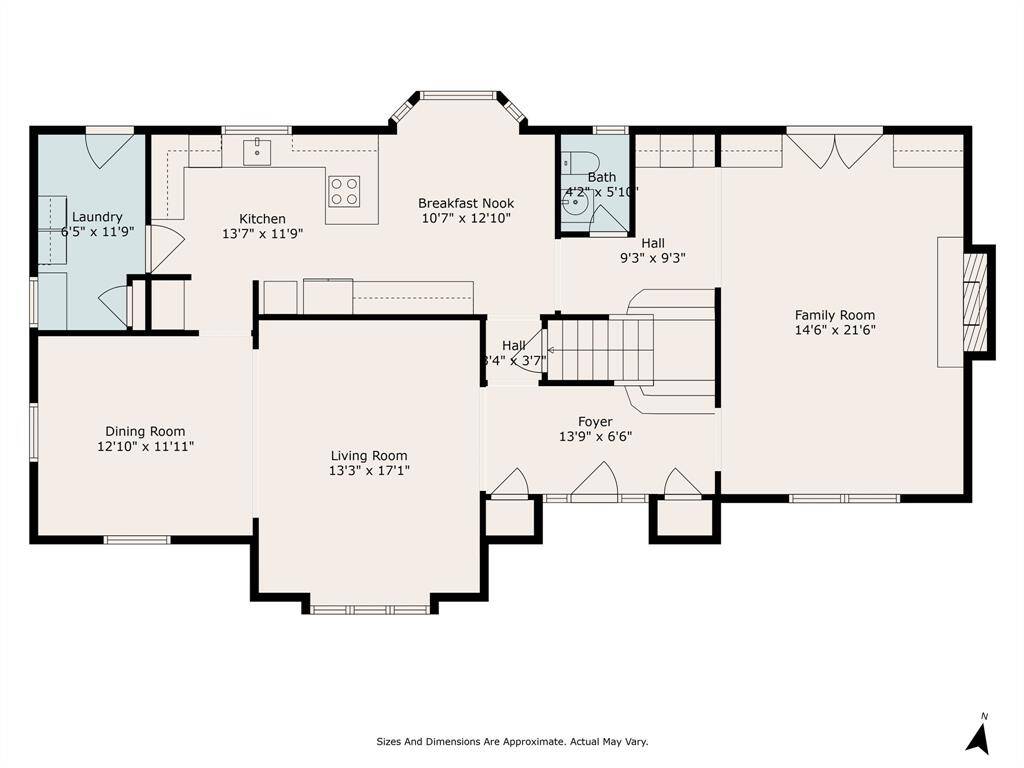 This floor plan layout features a spacious family room, a connected kitchen and breakfast nook, a formal dining room, and a cozy living room. It also includes a convenient laundry room and a small bath near the kitchen, with a central foyer leading to all areas.