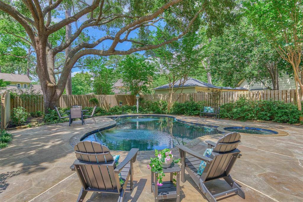 Start your day in this serene backyard oasis, perfect for sipping coffee by the pool.