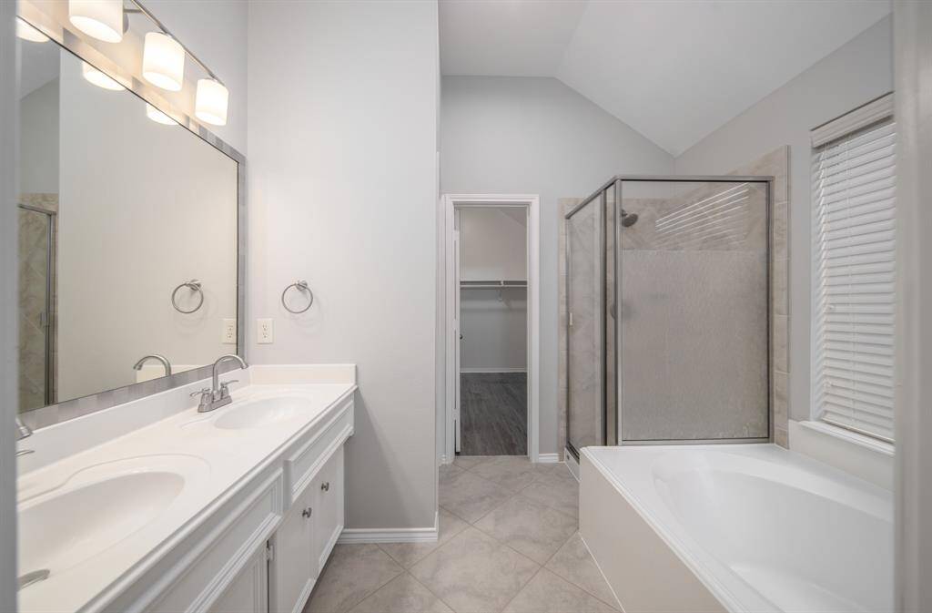 Delight in this primary bath that offers plenty of space to get ready each day.