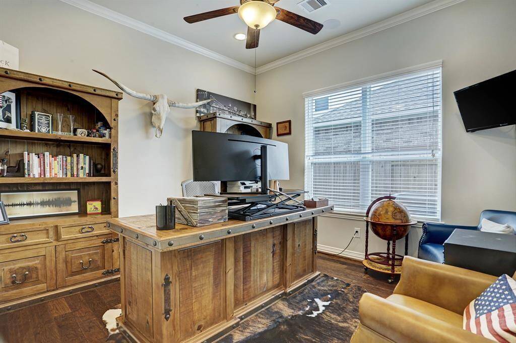 Need a home office, play room or extra guest room? This large secondary room on the first floor has many options. It is currently being used as a home office.