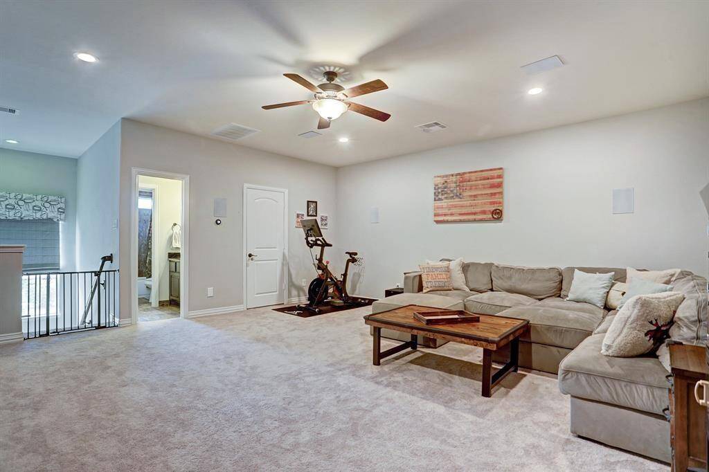 This spacious second-floor game room/living area has a full bath and extra storage. It’s perfect for movie nights or use it as a playroom for the kids.