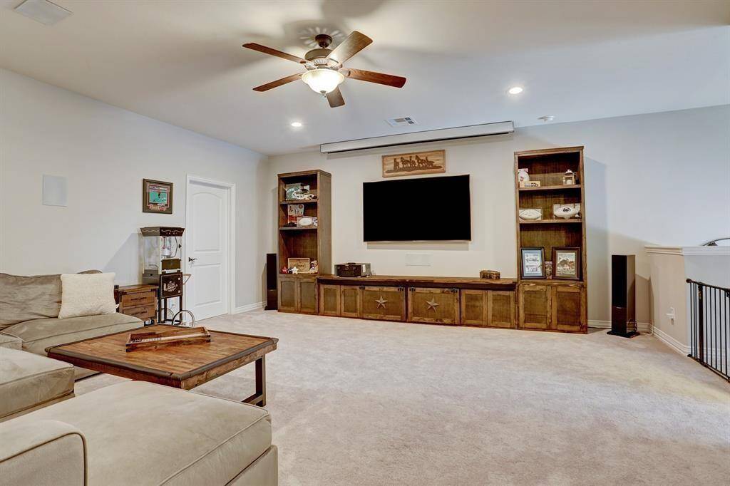 Second view of the spacious second-floor game room/living area.