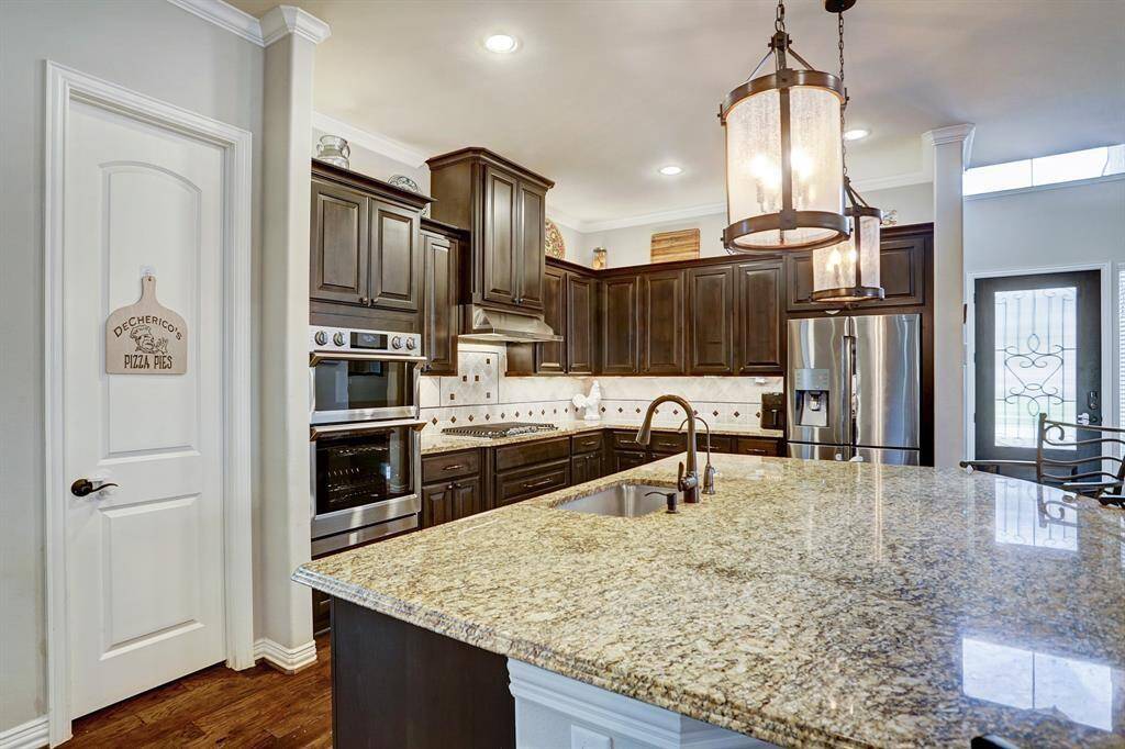 The kitchen has plenty of counter and storage space. Under cabinet lighting and well appointed walk in pantry.
