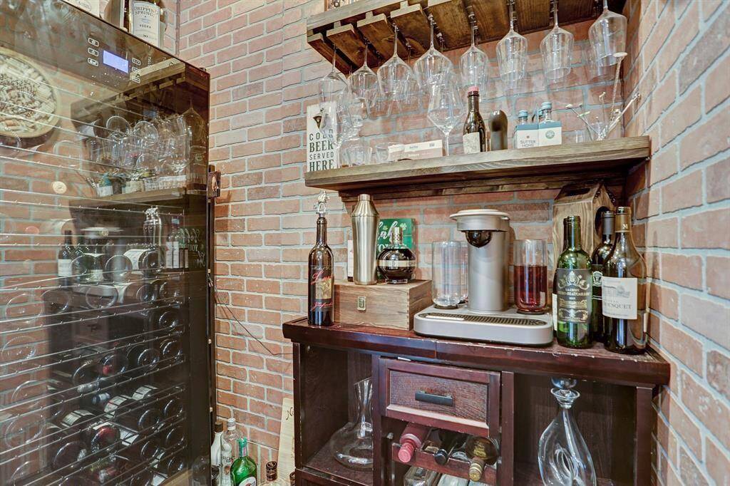 This wine room with brick accents can be used as a coffee or wine bar, which would be perfect for entertaining.