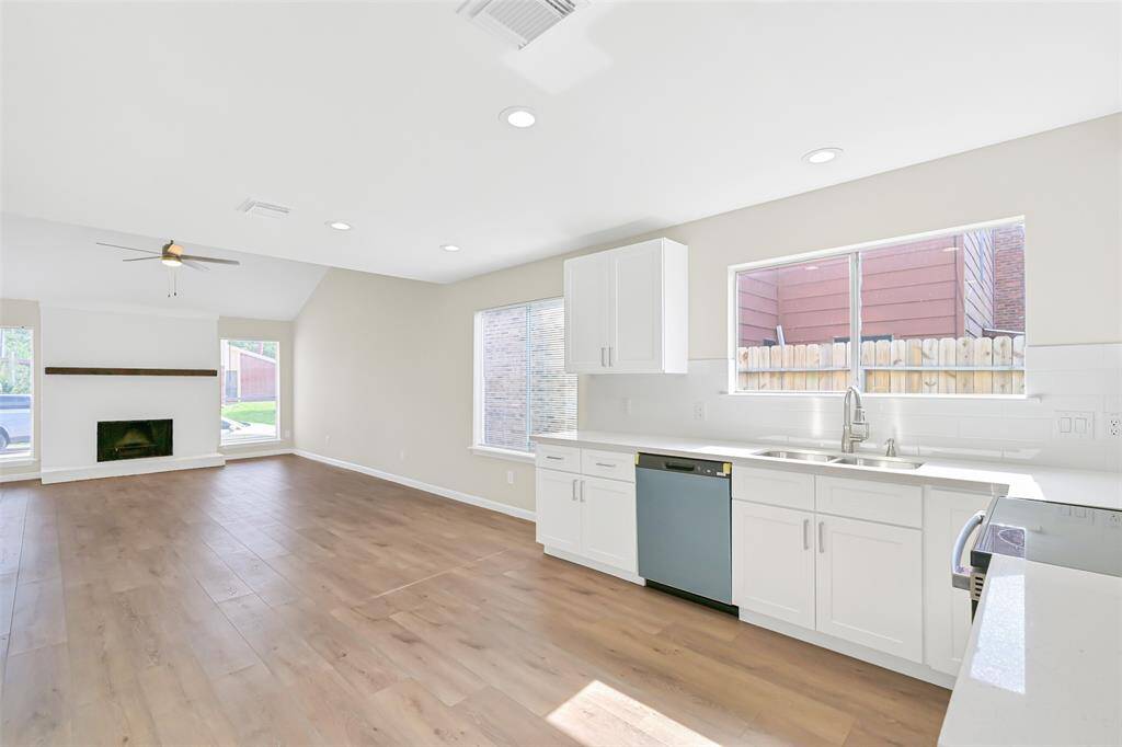 Enjoy the open layout that seamlessly connects the living room and kitchen, ideal for entertaining or enjoying family time together.