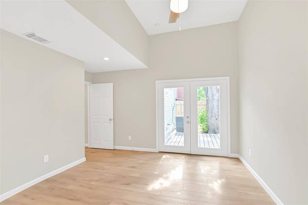 The soft, neutral tones throughout the primary bedroom offer a calm and inviting space, easily adaptable to any personal style or décor.