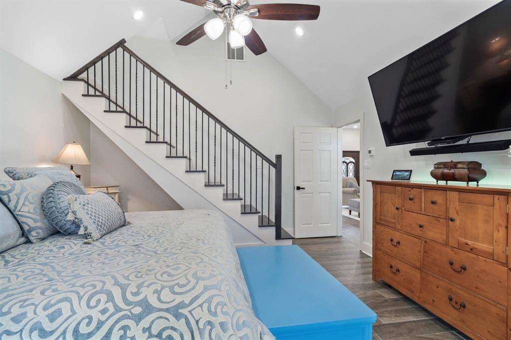 Another shot of the primary bedroom, the stairway leads you to a closet