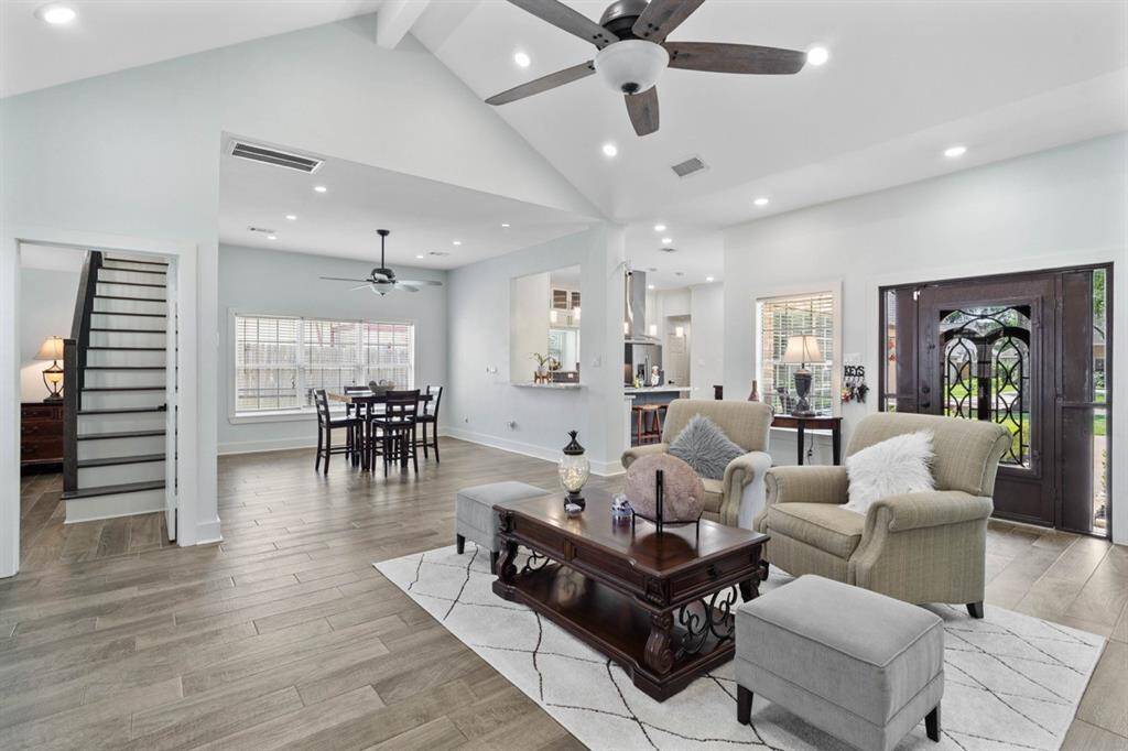 Open and desirable floor plan with recess lighting, natural light and vaulted ceilings