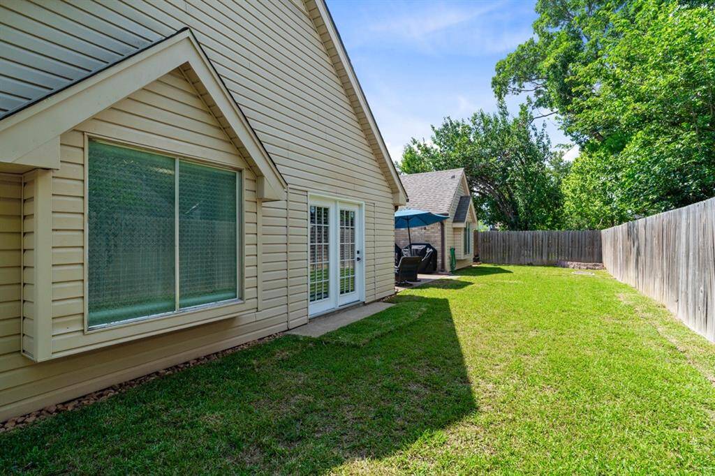 Backyard features lush green grass!